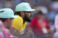 San Diego Padres' Fernando Tatis Jr. looks out from the dugout in the seventh inning of a baseball game against the Minnesota Twins, Saturday, July 30, 2022, in San Diego. (AP Photo/Derrick Tuskan)