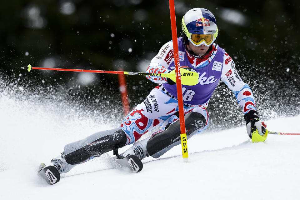 Alexis Pinturault of France clears a gate during the first run of the men's Alpine skiing slalom World Cup race at the Lauberhorn in Wengen, Switzerland, Sunday, Jan. 19, 2014. (AP Photo/Keystone, Jean-Christophe Bott)