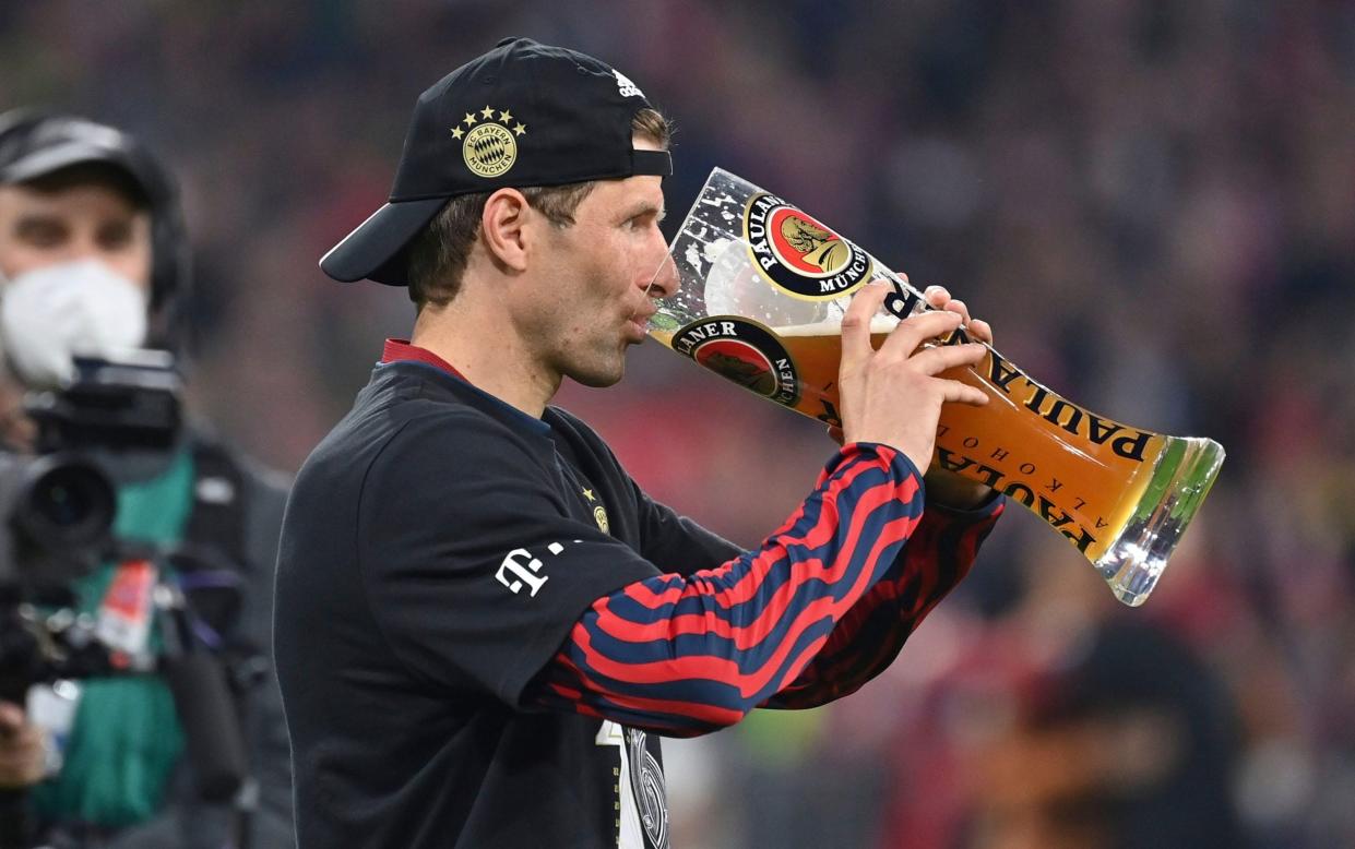 Prost! Footballer Thomas Müller, of Bayern Munich, enjoys an extra-large wheat beer