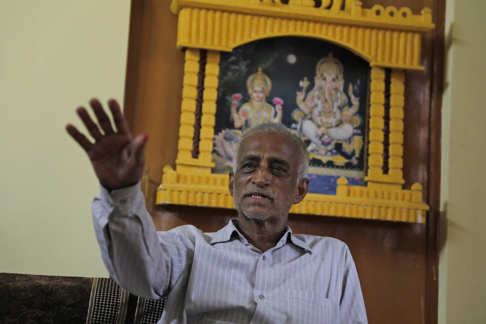 Radha Gobindo Pramanik speaks to the Associated Press inside his home in Lucknow, India, Thursday, June 3, 2021. Two months ago Pramanik and his wife threw a party to celebrate their daughter's pregnancy and the upcoming birth of their long-awaited grandchild. They were so happy that they paid little attention to his wife's cough. Within days, his wife, his daughter and his unborn grandchild were all dead, among the tens of thousands killed as the coronavirus ravaged India in April and May. (AP Photo/Rajesh Kumar Singh)