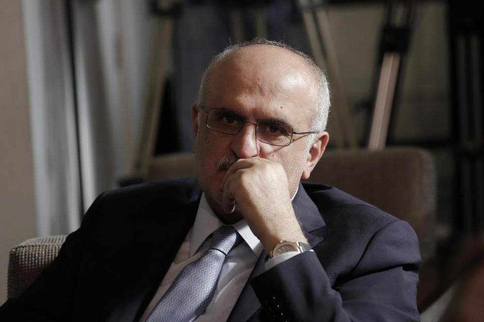 FILE - In this May 24, 2019, file photo, Lebanese Finance Minister Ali Hassan Khalil listens to Lebanese Information Minister Jamal Jarrah while he speaks to a journalist at the Government House in Beirut, Lebanon. The U.S. Treasury on Tuesday, Sept. 8, 2020, sanctioned two former Lebanese Cabinet ministers, including Khalil, who are allied with militant Hezbollah in a rare move against politicians close to the Iran-backed group. (AP Photo/Hassan Ammar, File)