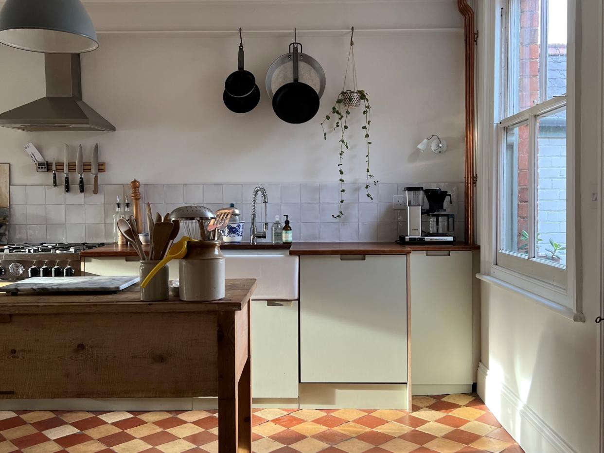  an ikea kitchen with a checkerboard floor 