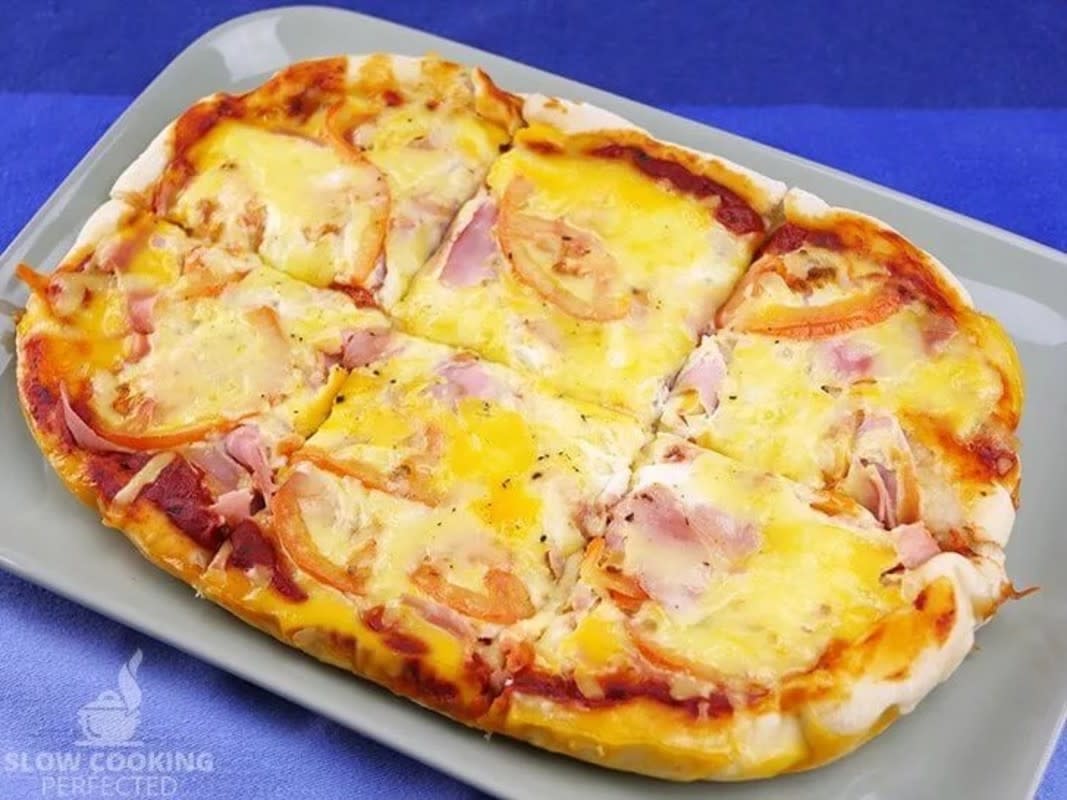 <p>Slow Cooking Perfected</p><p>This tasty slow cooker breakfast pizza is the perfect way to start the day. You can prepare it the night before and get it cooking as soon as you wake up.</p><p><strong>Get the recipe: <a href="https://slowcookingperfected.com/slow-cooker-breakfast-pizza/" rel="nofollow noopener" target="_blank" data-ylk="slk:Slow Cooker Breakfast Pizza;elm:context_link;itc:0;sec:content-canvas" class="link rapid-noclick-resp">Slow Cooker Breakfast Pizza</a></strong></p>