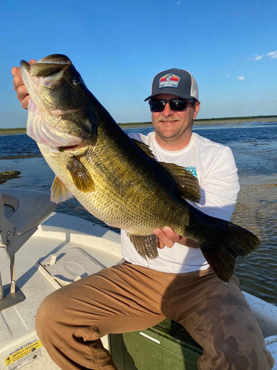 Adam Young of Brevard County and the 11-pound 1-ounce TrophyCatch he landed May 1, 2022.