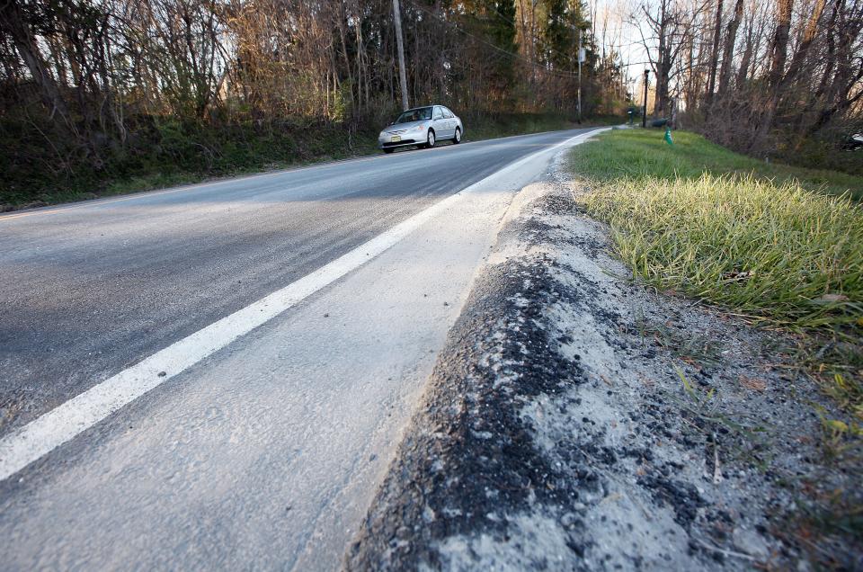 Rock dust is seen along Cork Hill Road in Franklin near the entrance to the Braen Stone Quarry Wednesday, April 13, 2016.