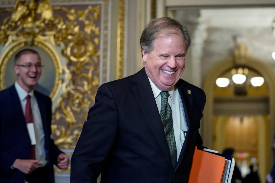 Sen. Doug Jones, D-Ala., arrives at the Senate chamber as the Senate impeachment trial of President Donald Trump continues at the U.S. Capitol on Jan. 31, 2020, in Washington.