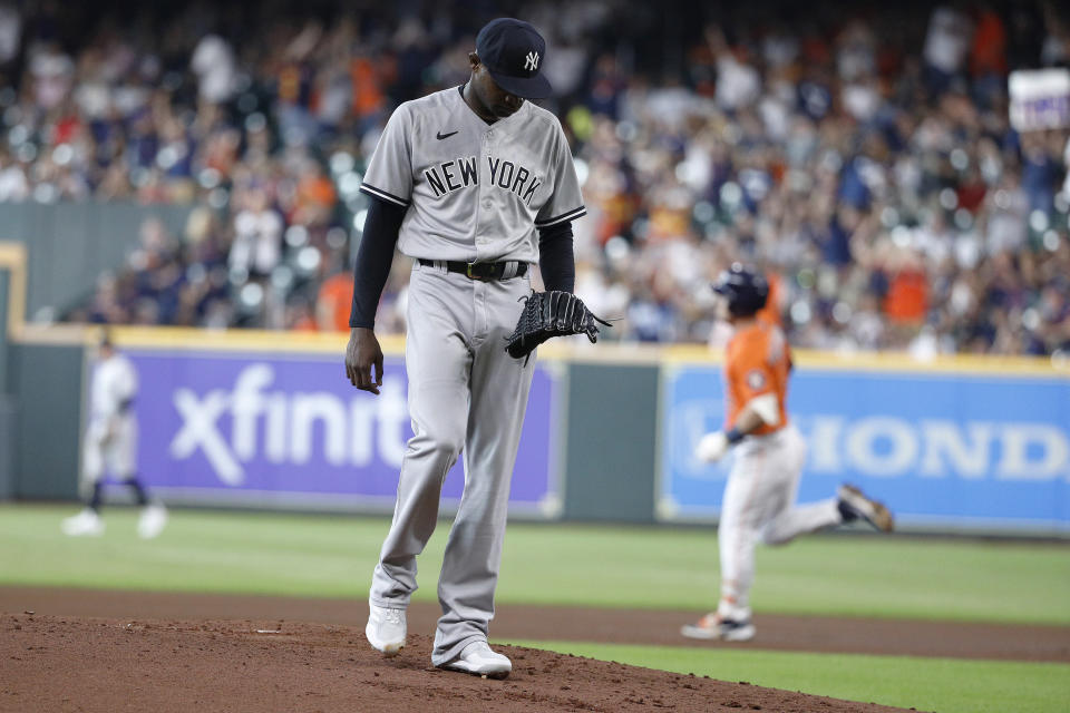New York Yankees starting pitcher Domingo German walks on the mound after giving up back-to-back home runs to Houston Astros' Yordan Alverez and Alex Bregman during the first inning in the second game of a baseball doubleheader Thursday, July 21, 2022, in Houston. (AP Photo/Kevin M. Cox)