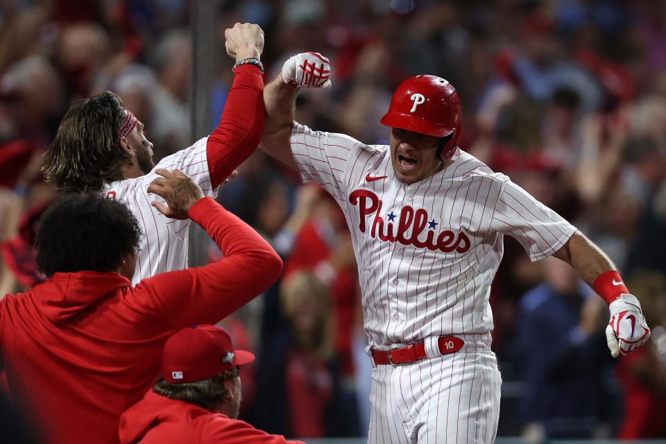Game 2 at Philadelphia: Phillies catcher J.T. Realmuto celebrates after hitting a solo home run in the fourth inning.