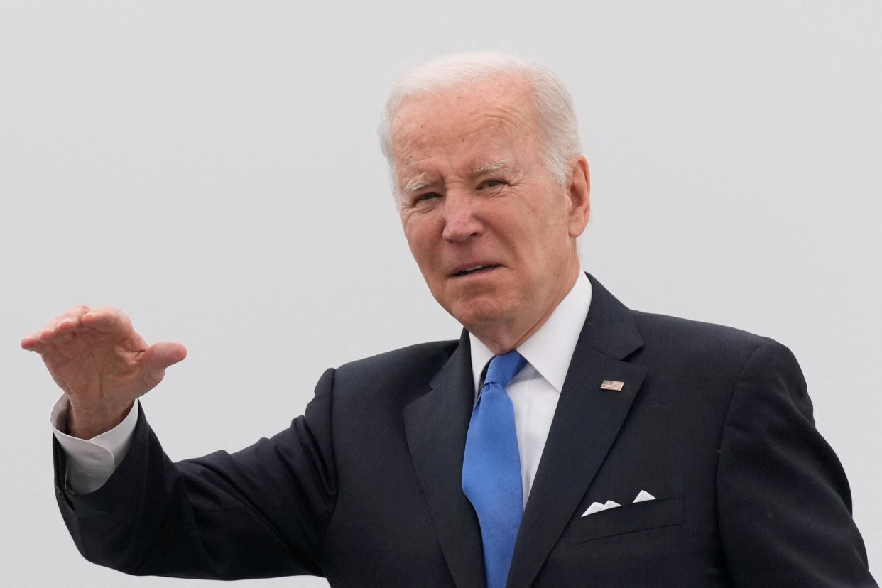U.S. President Joe Biden gestures as he boards Air Force One for return travel to Washington, at Dover Air Force Base in Dover, Delaware, U.S., January 23, 2023. REUTERS/Ken Cedeno