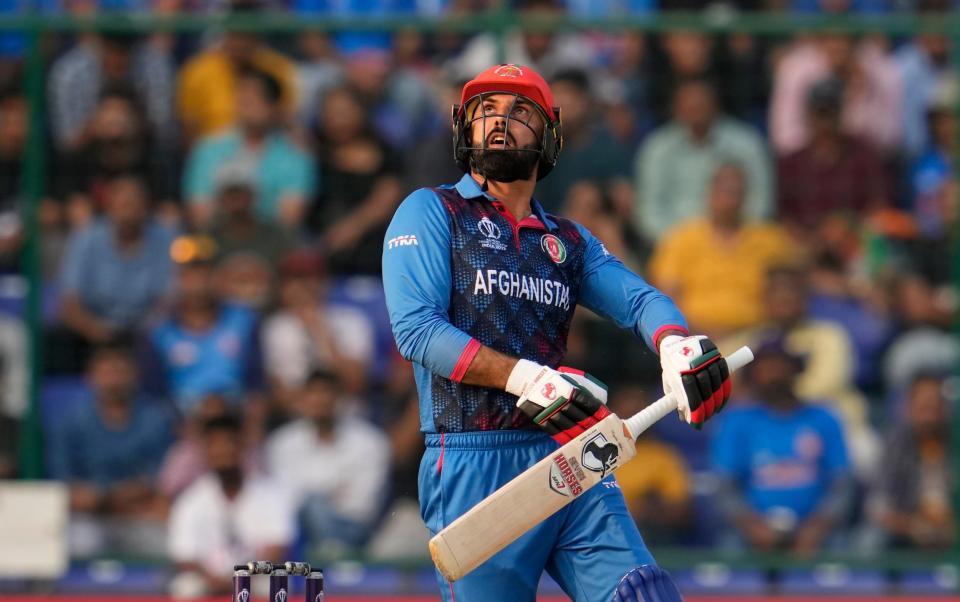 Afghanistan's Mohammad Nabi looks at his shot which England's Joe Root successfully caught to dismiss him