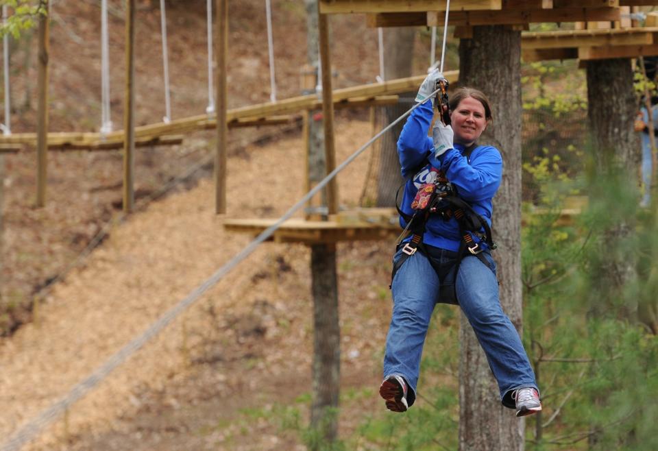 After battling neighbors who live next to the Heritage Museums & Gardens property in Sandwich for five years, a court decision reached Tuesday will enable Heritage to reopen its Adventure Park. In a 2015 photo, Rhonda Schnipke of Ohio tests out a zip line at the Adventure Park.