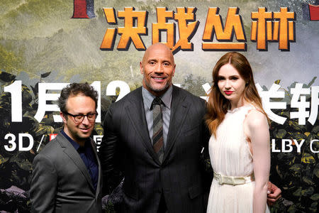 Director Jake Kasdan (L), cast members Dwayne Johnson (C)and Karen Gillan attend a news conference promoting their film "Jumanji: Welcome to the Jungle" in Beijing, China, January 4, 2018. REUTERS/Jason Lee