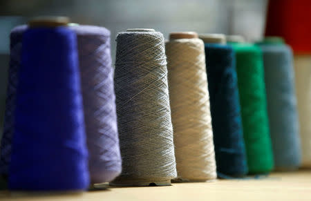 Wool reels are pictured at the Adidas Knit for You store in Berlin, Germany March 7, 2017. REUTERS/Fabrizio Bensch