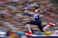 Britain's Phillips Idowu competes in the men's triple jump qualification during the London 2012 Olympic Games at the Olympic Stadium August 7, 2012.