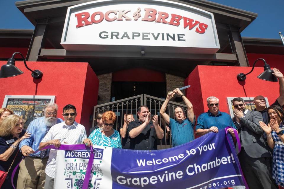 Rock & Brews representatives and Grapevine city officials celebrate the grand opening of Rock & Brews on Tuesday, July 2, 2024, in Grapevine.