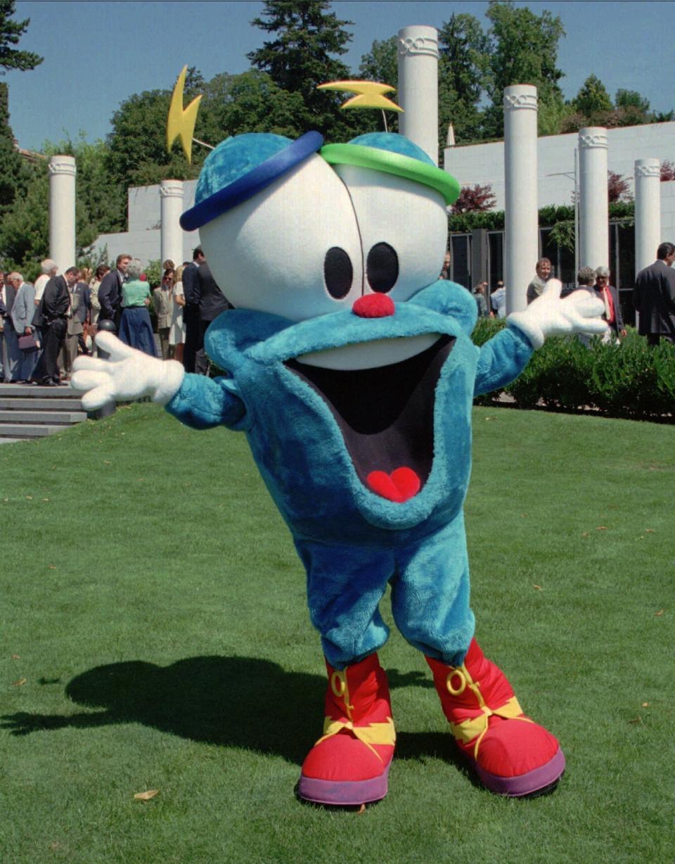 FILE - In this July 19, 1995, file photo, Izzy, the mascot of the Olympic Games of Atlanta 1996, dances in front of the Olympic Museum in Lausanne, Switzerland. The much-hated blob that represented the 1996 Atlanta Games has been supplanted by the mascot for the Paris Olympics — a Phrygian cap. (AP Photo/Donald Stampfli, File)