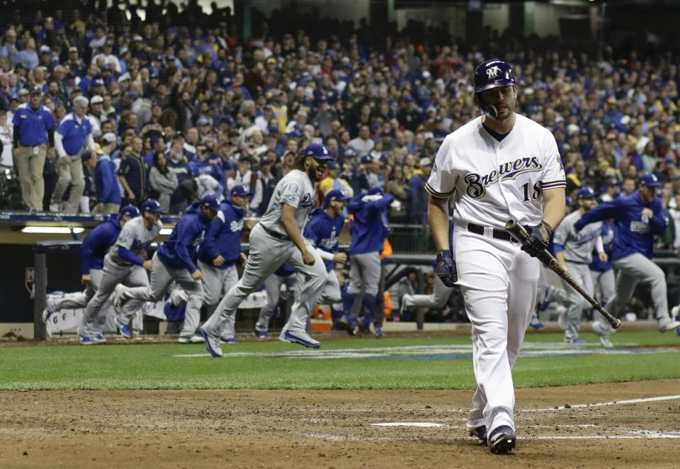 The Los Angeles Dodgers celebrate after Game 7 of the National League Championship Series baseball game against the Milwaukee Brewers Saturday, Oct. 20, 2018, in Milwaukee. The Dodgers won 5-1 to win the series. (AP Photo/Matt Slocum)