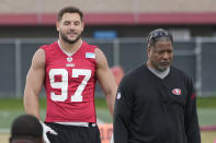 San Francisco 49ers defensive end Nick Bosa (97) and defensive coordinator Steve Wilks, right, watch as players practice at the team's NFL football training facility in Santa Clara, Calif., Thursday, Feb. 1, 2024. The 49ers will face the Kansas City Chiefs in Super Bowl 58. (AP Photo/Tony Avelar)