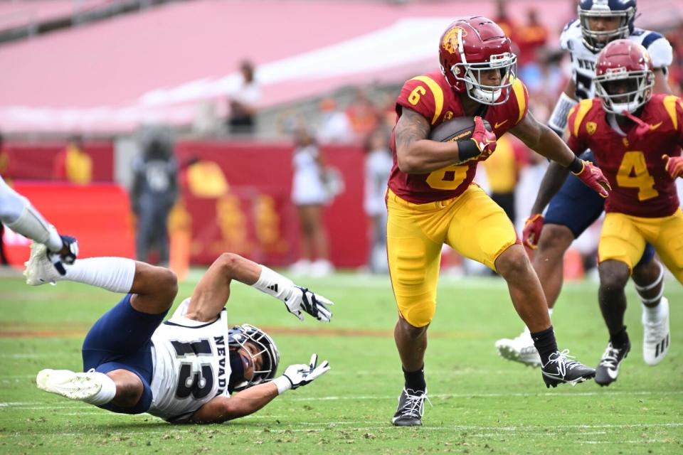 USC running back Austin Jones breaks away from Nevada safety Ezekiel Robbins during a Trojans' win in September.