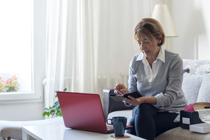 A senior calculating her retirement expenses.