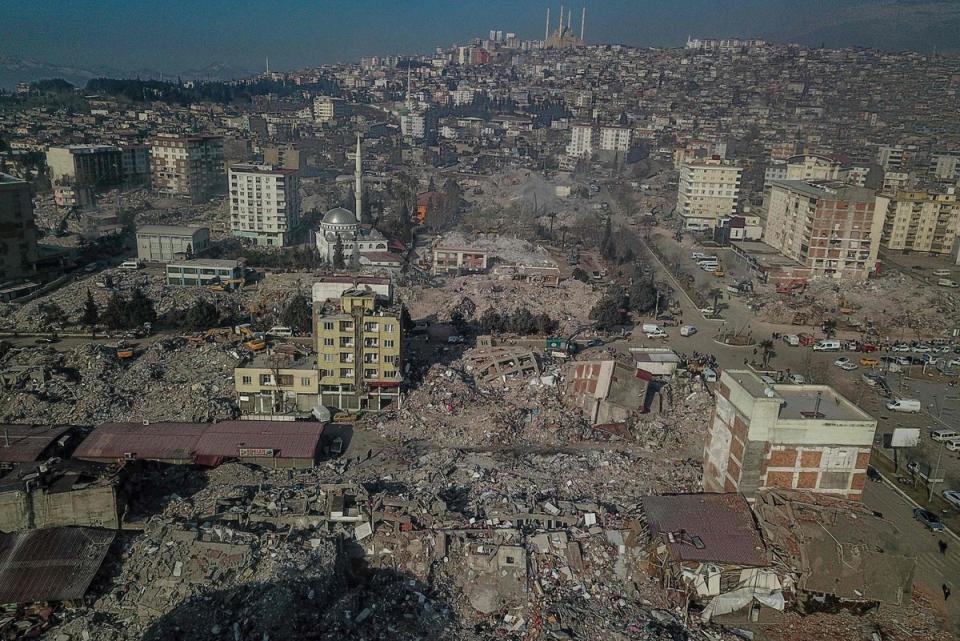 This aerial view shows collapsed buildings during ongoing rescue operations in Kahramanmaras (BULENT KILIC/AFP via Getty Images)