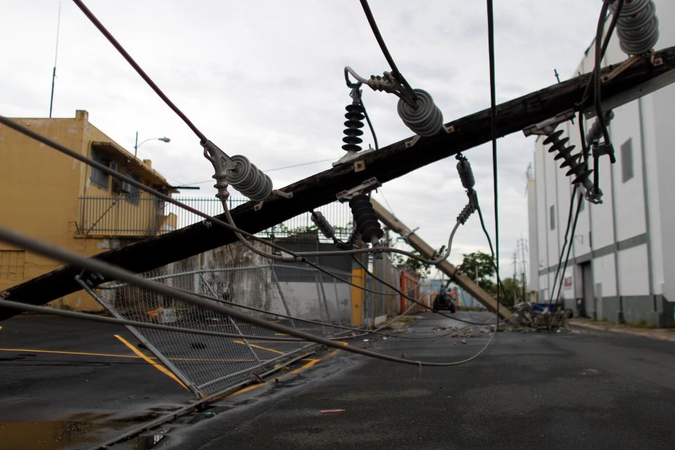 A power line in San Juan months after it was downed by Hurricane Maria.&nbsp; (Photo: RICARDO ARDUENGO via Getty Images)