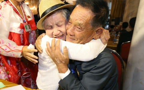 South Korean Lee Keum-seom, 92, meets her North Korean son Ri Sung Chol, 71 - Credit: AFP/AFP