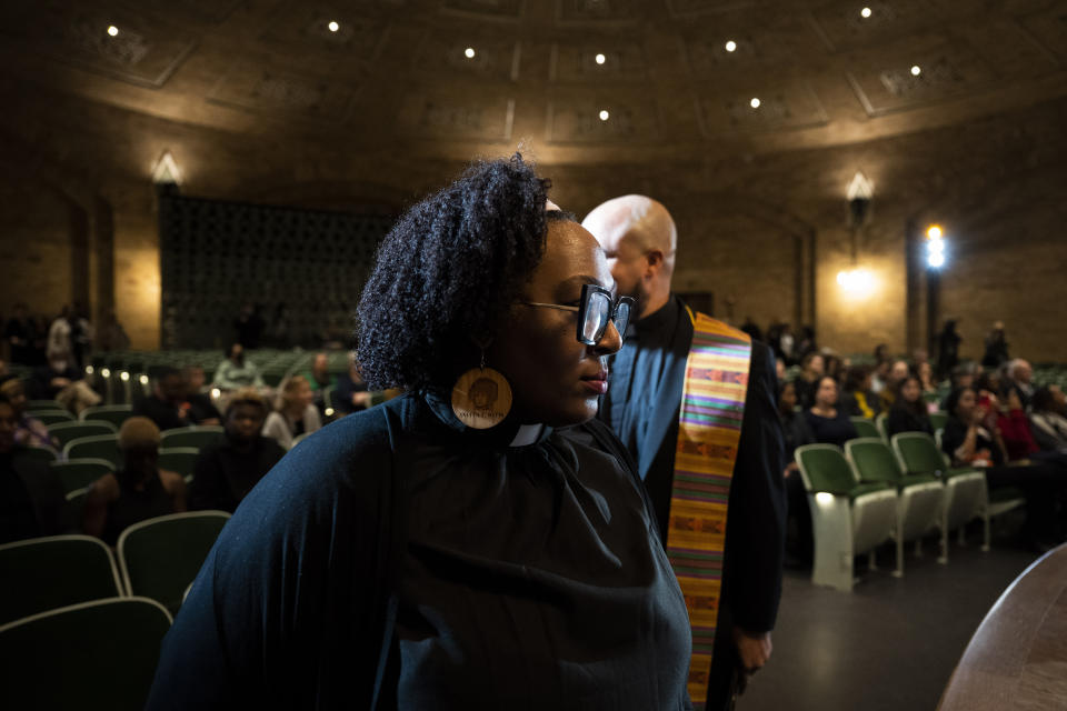 Rev. Jamie Eaddy-Chism, a theologian and activist, takes the stage as a speaker during a public commemoration service for 19 unidentified Black Philadelphians whose remains were part of a display at the University of Pennsylvania's Penn Museum on Saturday, Feb. 3, 2024, in Philadelphia. As part of a growing effort among museums to reevaluate the curation of human remains, the Ivy League school laid some of the remains to rest last week. (AP Photo/Joe Lamberti)