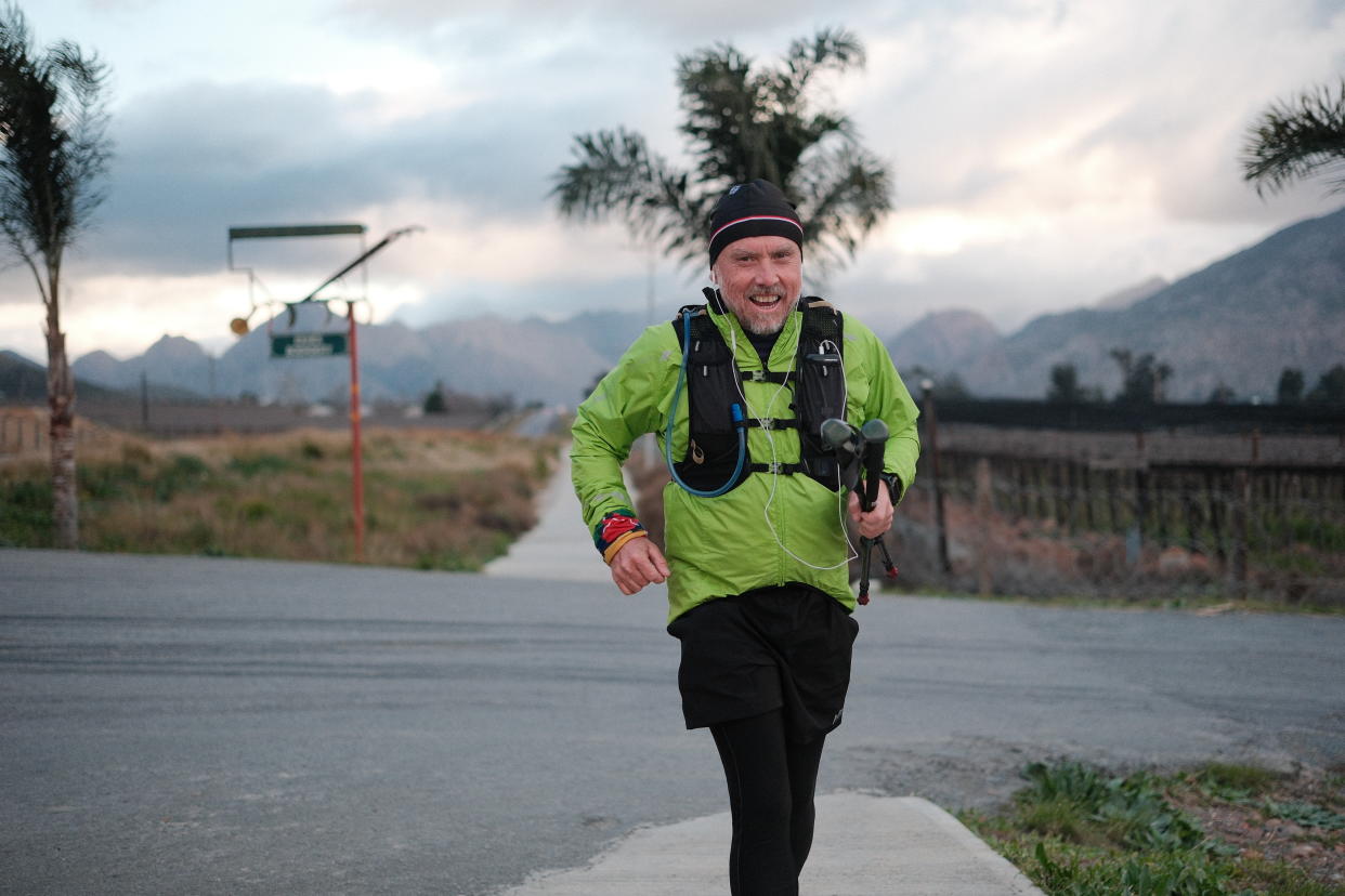 Man in high-vis clothing running