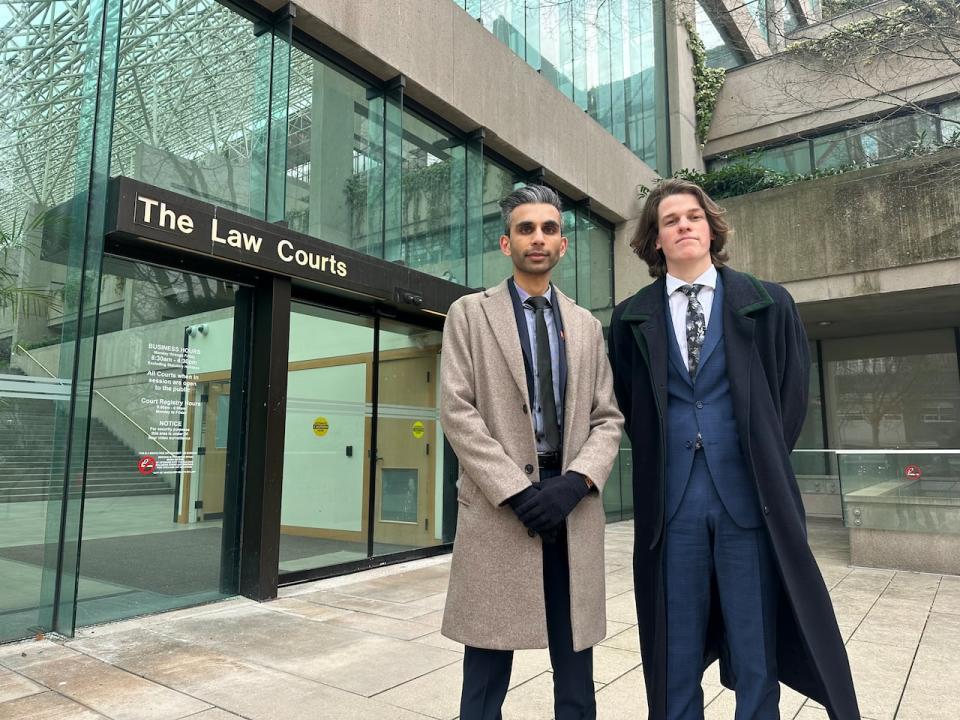SJC member Matthew Cheesman, right, and Shawn Ullah, a B.C. representative for the National Council of Canadian Muslims, stands outside the B.C. Supreme Court on Thursday.