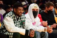 <p>Usher and Justin Bieber hang out at the Golden State Warriors vs. Los Angeles Lakers game on Oct. 19 at the Staples Center in L.A. </p>