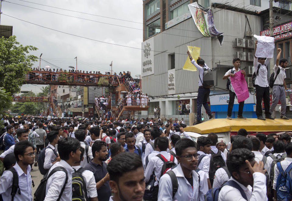 Bangladeshi students shout slogans as they block a road during a protest in Dhaka, Bangladesh, Wednesday, Aug. 1, 2018. Students blocked several main streets in the capital, protesting the death of two college students in a bus accident in Dhaka. (AP Photo/A. M. Ahad)