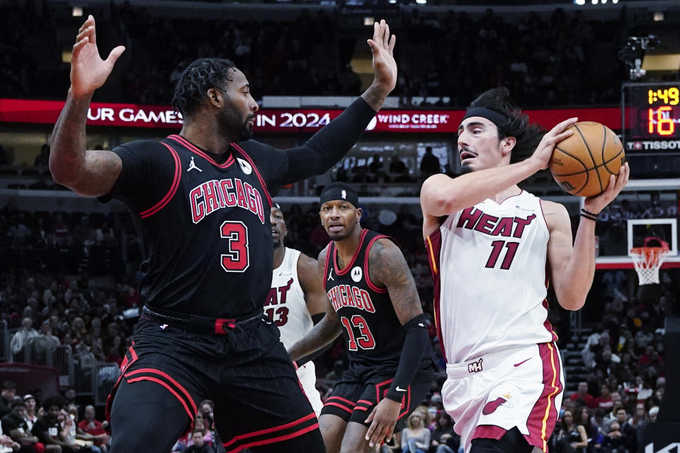 Miami Heat guard Jaime Jaquez Jr., right, drives to the basket as Chicago Bulls center Andre Drummond, left, guards during the first half of an NBA basketball game in Chicago, Saturday, Nov. 18, 2023. (AP Photo/Nam Y. Huh)