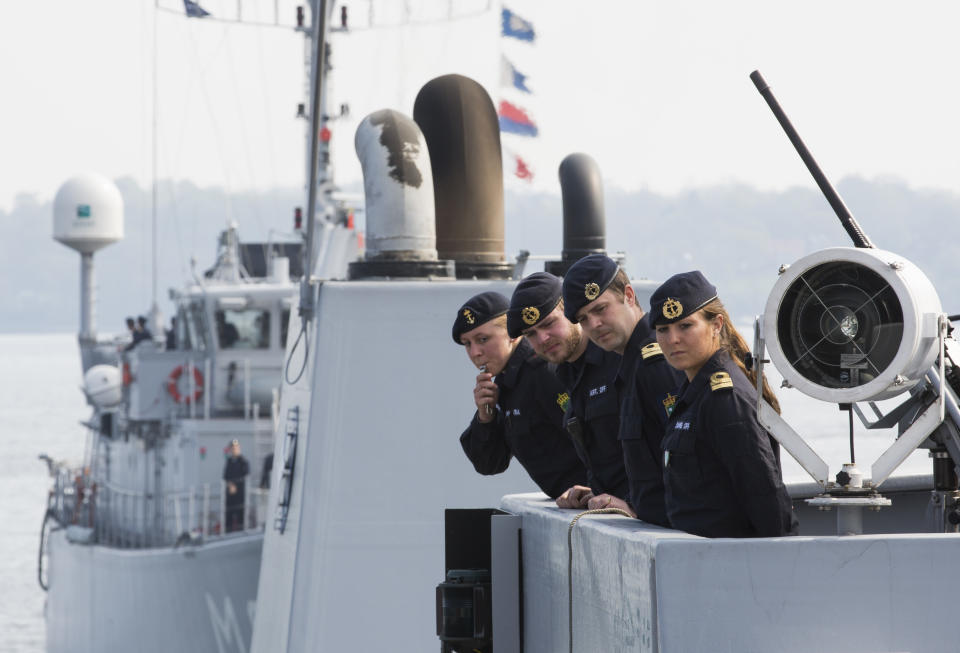 Crew members of Norwegian minesweeper Otra stand on the bridge as they set sail together with Dutch minehunter Makkum, background, and three other ships of Belgium and Estonia from Kiel, Germany, Tuesday, April 22, 2014. The warships are part of the standing NATO Mine Counter-Measures Group ONE, one of NATO’s four standing Maritime Forces, deploying to the Baltic Sea to enhance maritime security and readiness in the region. The maritime Group was reactivated by a North Atlantic Council decision to enhance collective defense and assurance measures in response to the crisis in Ukraine. (AP Photo/Gero Breloer)