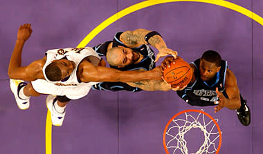 Andrew Bynum battles against Carlos Boozer (center) and C.J. Miles