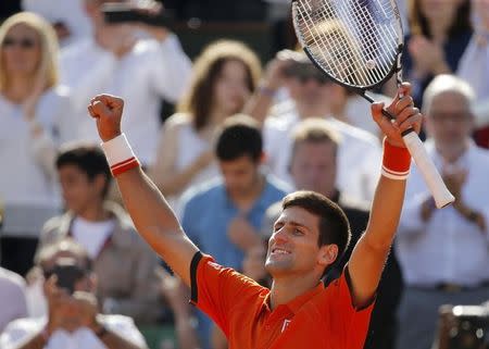 Novak Djokovic of Serbia celebrates after defeating Rafael Nadal of Spain during their men's quarter-final match during the French Open tennis tournament at the Roland Garros stadium in Paris, France, June 3, 2015. REUTERS/Vincent Kessler -