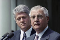 FILE - In this June 1993 file photo, President Bill Clinton stands behind his nominee for Ambassador to Japan, former Vice President Walter Mondale. Mondale, a liberal icon who lost the most lopsided presidential election after bluntly telling voters to expect a tax increase if he won, died Monday, April 19, 2021. He was 93. (AP Photo/Greg Gibson, File)
