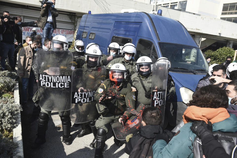 Police clash with protesters at the University of Thessaloniki in northern Greece, on Monday, Feb. 22, 2021. Police clashed with protesters and detained more than 30 people in Greece's second-largest city Monday during a demonstration against a new campus security law. (AP Photo/Giannis Papanikos)