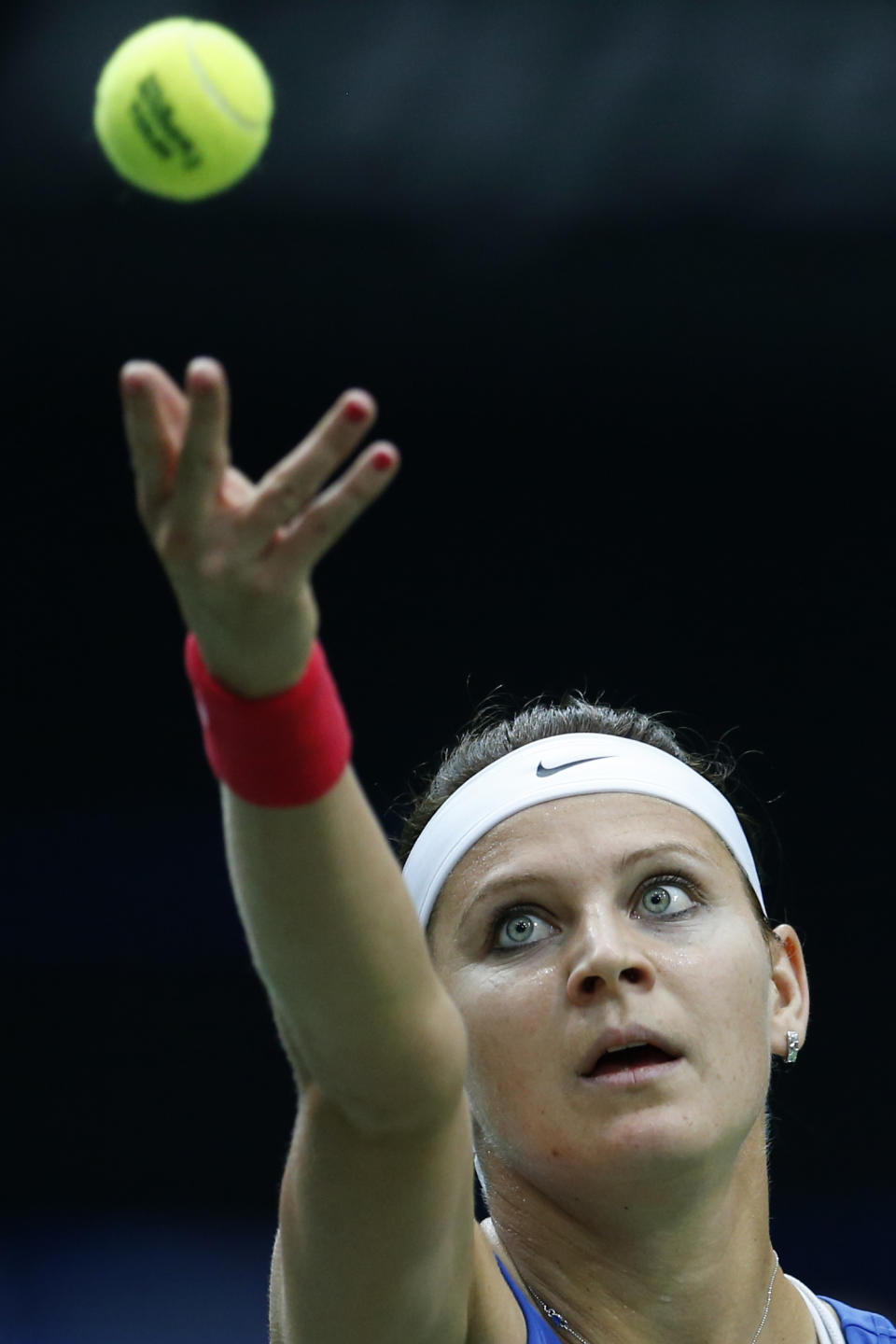 Czech Republic's Lucie Safarova serves a ball to Italy's Sara Errani during the Fed Cup semifinals in Ostrava, Czech Republic, Saturday, April 19, 2014. (AP Photo/Petr David Josek)