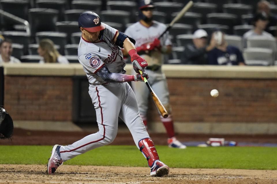 Washington Nationals' Joey Meneses hits an RBI single during the ninth inning of a baseball game against the New York Mets, Saturday, July 29, 2023, in New York. (AP Photo/Frank Franklin II)