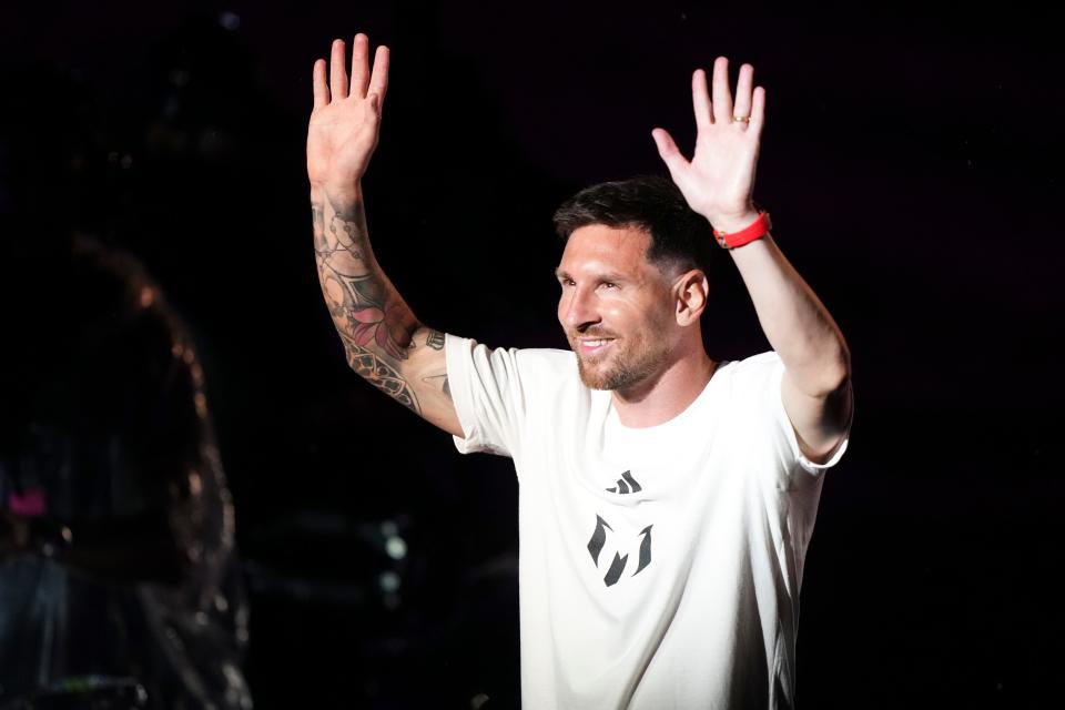 Lionel Messi gestures after being introduced at The Unveil event for his Inter Miami arrival at DRV PNK Stadium.