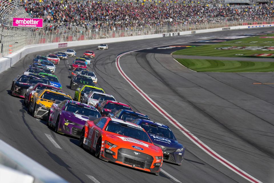 Brad Keselowski (6) leads Alex Bowman (48), Tyler Reddick (45) and Joey Logano (22) into Turn 1 at Atlanta Motor Speedway during the 2023 Ambetter Health 400.