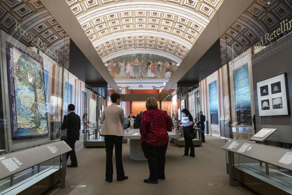 People visit the exhibit, "Collecting Memories: Treasures from the Library of Congress," during a media preview at the Library of Congress, Monday, June 10, 2024, in Washington. (AP Photo/Jacquelyn Martin)