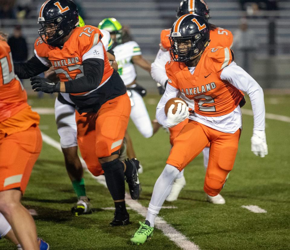 Lakeland running back D'Marius Rucker looks for for running room against Lake Minneola on Friday night in the Class 4S, Region 2 final at Bryant Stadium.
