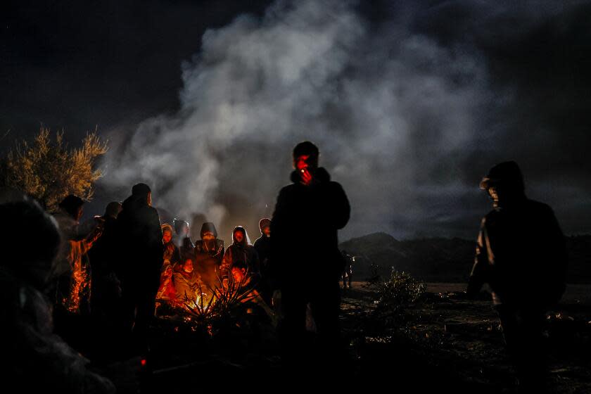 Asylum seekers from China, camp near the border wall, often waiting days to be transported by the U.S. Border Patrol.