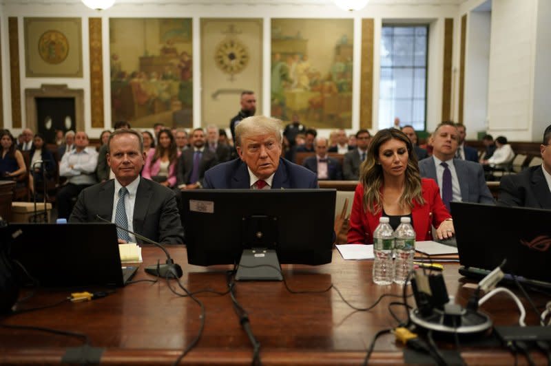 Former President Donald Trump sits in the courtroom for day two of his civil fraud trial at State Supreme Court on Tuesday in New York City. Judge Arthur Engoron issued "a gag order on all parties with respect to posting or publicly speaking about any member on my staff.” Pool Photo by Seth Wenig/UPI