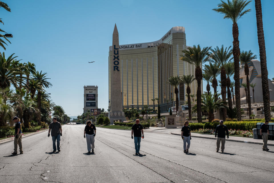 <p>Members of the FBI walk a stretch of South Las Vegas Boulevard, which is still closed off to the public, near the Mandalay Hotel and the site of Sunday’s mass shooting which claimed the lives of dozens of people and injured hundreds of others, in Las Vegas, Nev., Oct. 3, 2017. (Photo: Nick Otto via ZUMA Wire) </p>