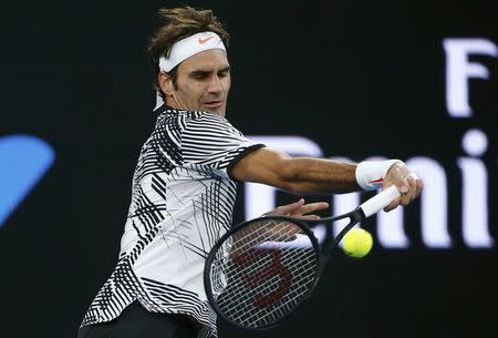 Tennis - Australian Open - Melbourne Park, Melbourne, Australia - 24/1/17 Switzerland's Roger Federer hits a shot during his Men's singles quarter-final match against Germany's Mischa Zverev. REUTERS/Thomas Peter