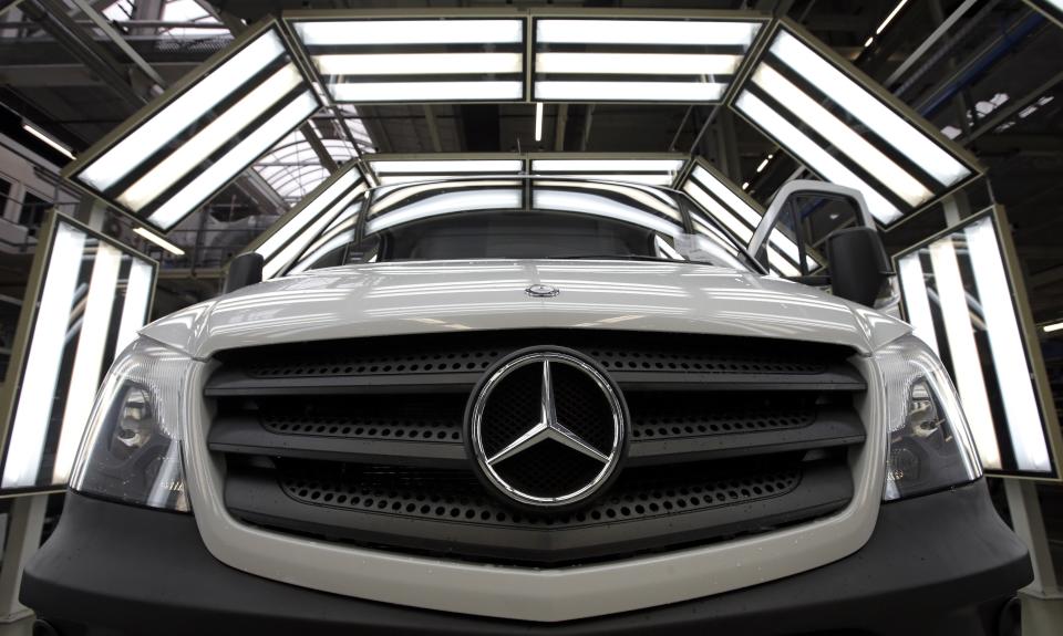 FILE - In this June 23, 2015 file photo a van is pictured in a light tunnel at the Mercedes-Benz automobile plant in Ludwigsfelde, near Berlin. Daimler did present figures on Wednesday, April 29, 2020. German automaker Daimler on Friday dismissed a “cease and desist” demand from two environmental groups to commit to ending the sale of combustion engine vehicles by 2030. Lawyers for Greenpeace and the group Deutsche Umwelthilfe have threatened to sue Daimler, BMW and Volkswagen unless they sign a legal pledge not to put new gas-fueled vehicles onto the market from the end of this decade. (Photo/Michael Sohn, file)