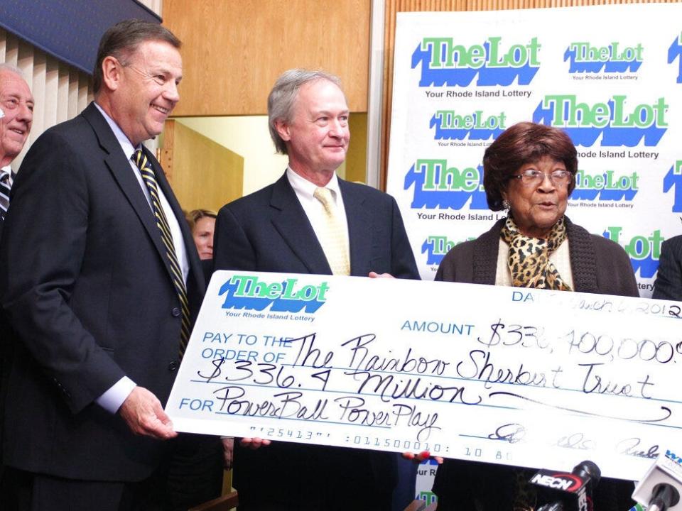 Louise White, right, from Newport, Rhode Island, is presented a check for $336 million